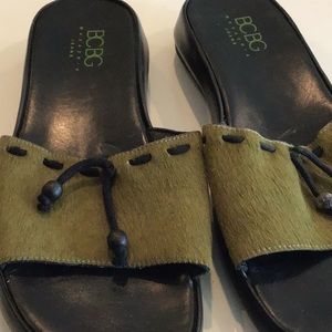 BCBG leather slides with animal hair and tassel trim.  Size 8B.